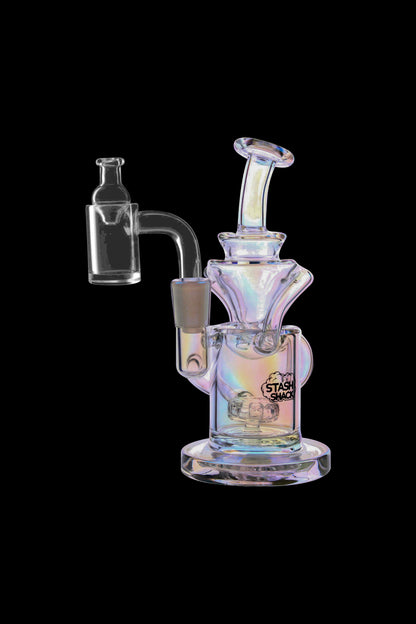 Iridescent glass dab rig with a quartz banger, isolated on a black background.
