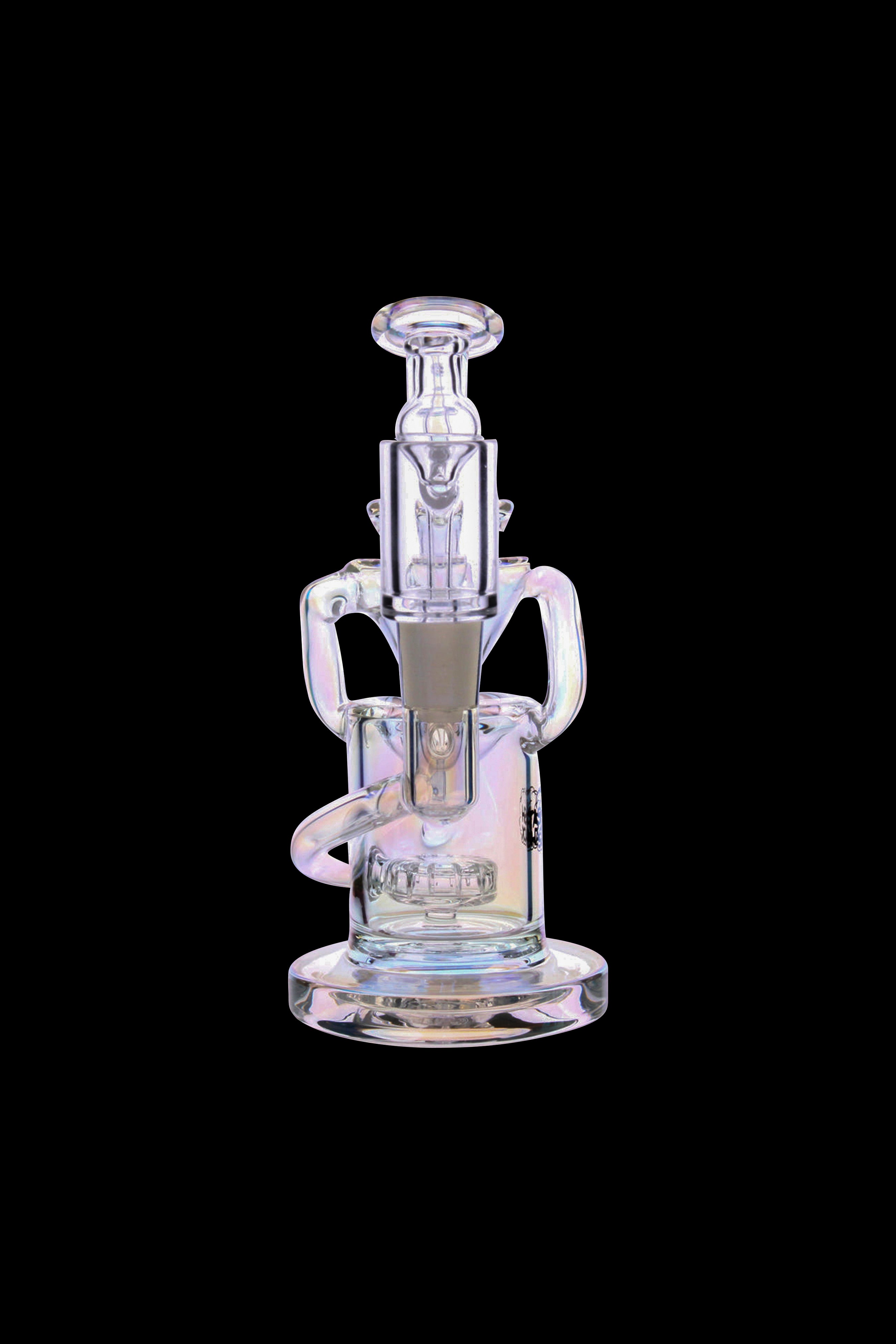 Iridescent glass dab rig with intricate curves and a bowl piece, isolated on a black background.