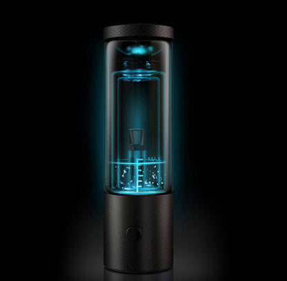 Centered front view of the Cloudious9 Carti9 510 Vape Cart Liquid Filtration Vaporizer in silver, lit with teal internal backlighting inside a glass chamber.