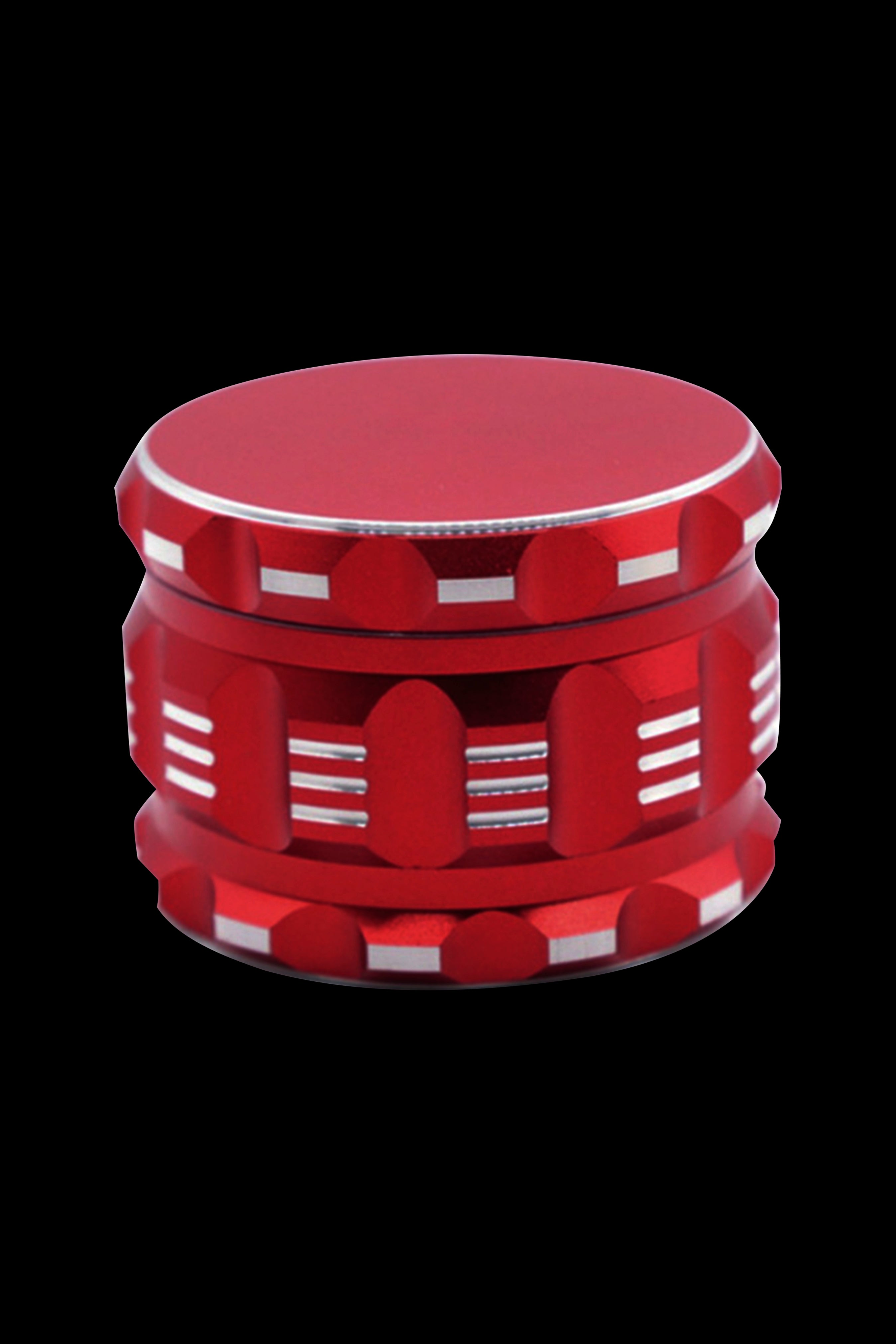 Red cannabis grinder with a casino chip design.