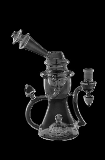 Clear glass water pipe (rig) with intricate design and multiple chambers, isolated on a black background.