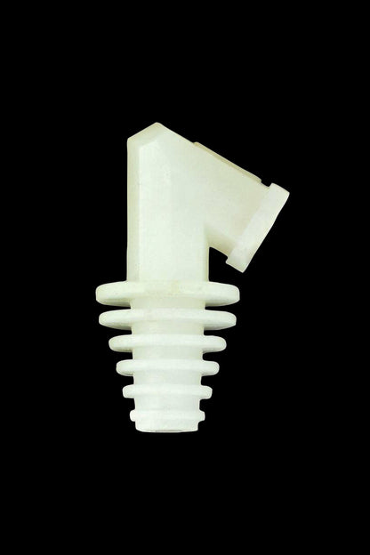 Pale green glass cannabis oil syringe tip isolated on a black background.