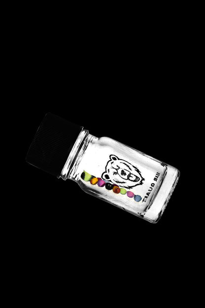 Glass jar with colorful cannabis buds inside, labeled with a bear illustration.