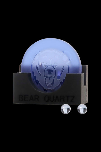 Blue quartz dab rig shaped like a bear's head with accompanying quartz nails, displayed on a black base labeled "BEAR QUARTZ."