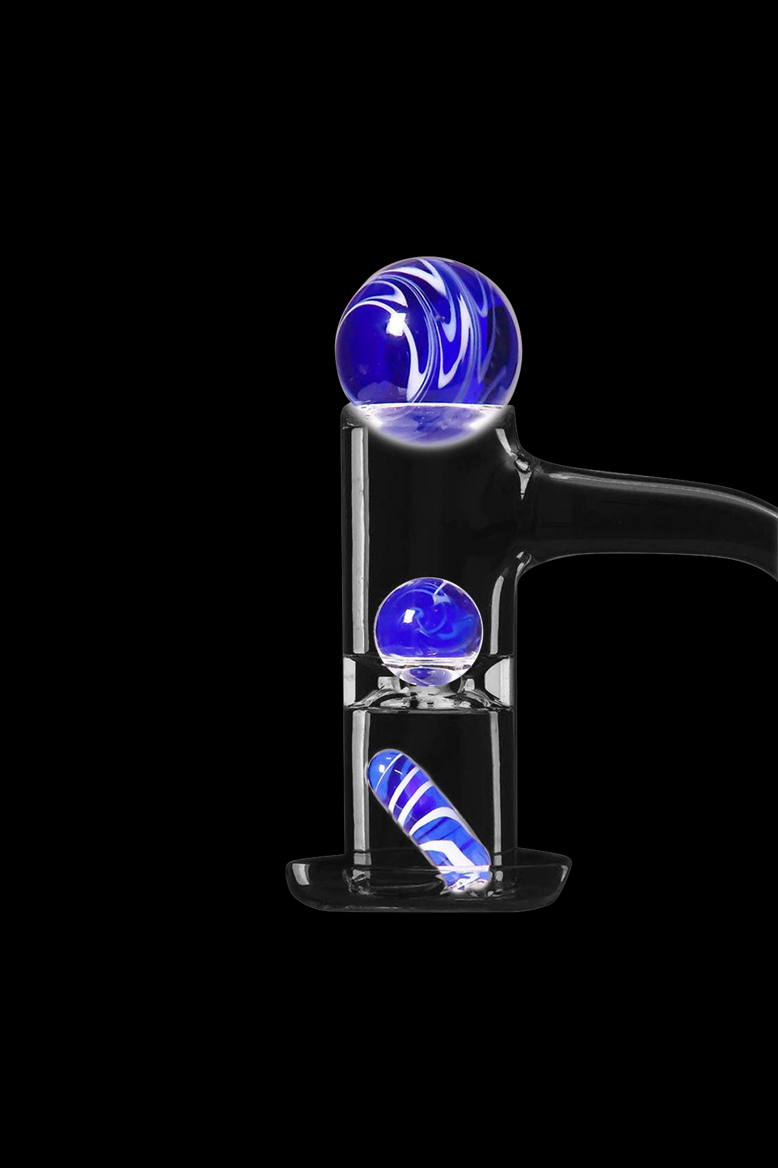 Blue glass oil rig with spherical bubblers against a black background.
