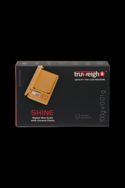 Product packaging for a TruWeigh digital mini scale with chrome finish, displaying "0.000" on the screen and boasting a 10-year warranty.