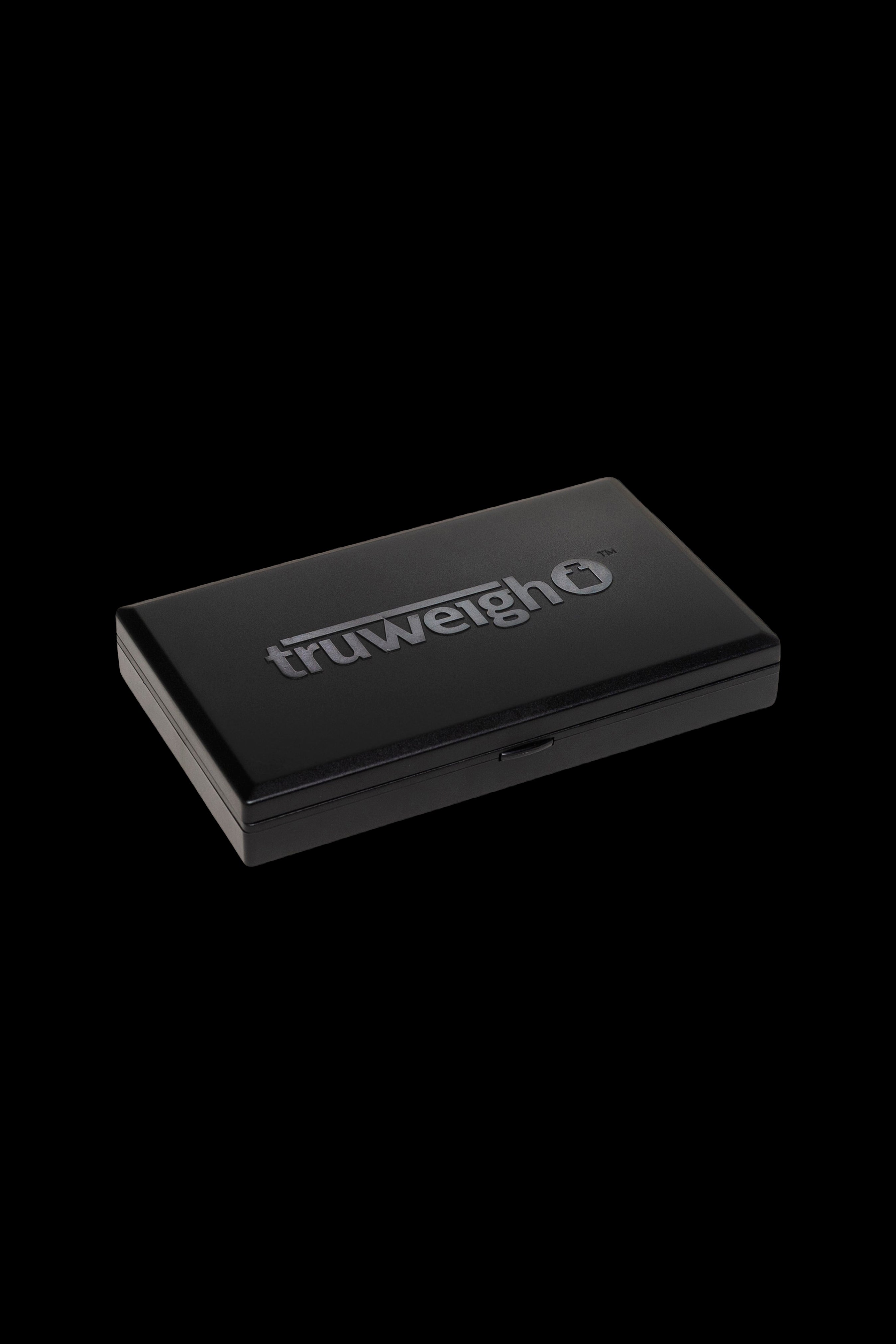 Black TruweighO digital scale for cannabis, displayed on a dark background.