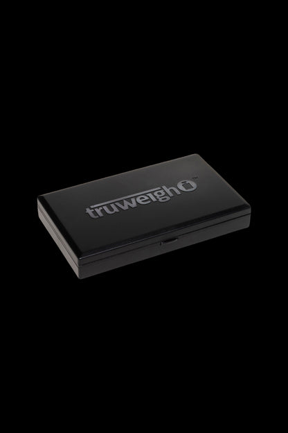 Black TruweighO digital scale for cannabis, displayed on a dark background.