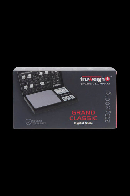 Angled front shot of the Truweigh Grand Classic Digital Scale - 200g x 0.01g box showing the open scale image and logo on a dark background