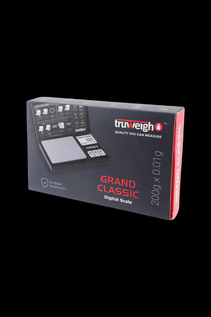 Angled view of the boxed Truweigh Grand Classic Digital Scale showing the black and red packaging and an image of the open scale on the front.