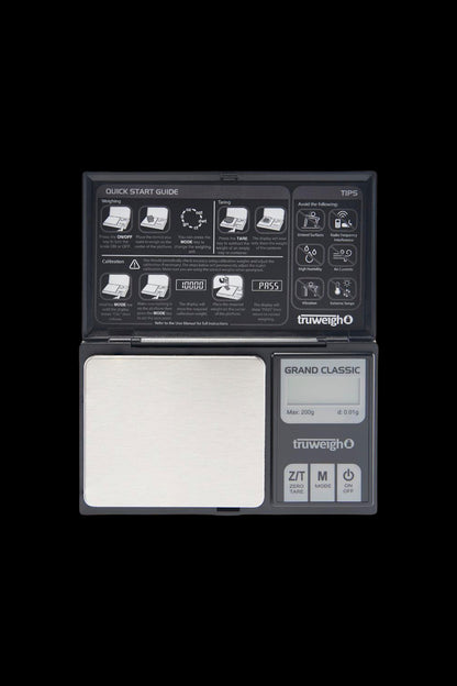 Top-down close-up of the Truweigh Grand Classic Digital Scale - 200g x 0.01g showing its stainless steel weighing plate, LCD display and labeled control buttons.
