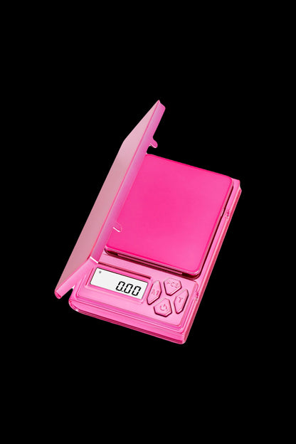 Pink digital scale for measuring cannabis.