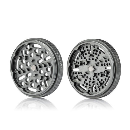 Front-facing view of two metallic RYOT GR8TR Solid Body Grinder halves side by side on a white background with soft reflections.