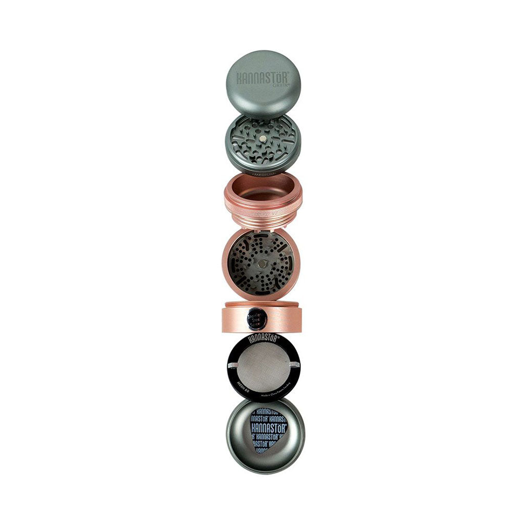 Vertical exploded view of the RYOT GR8TR Solid Body Grinder showing its stacked metal chambers, screens, and patterned grinding plates against a white background