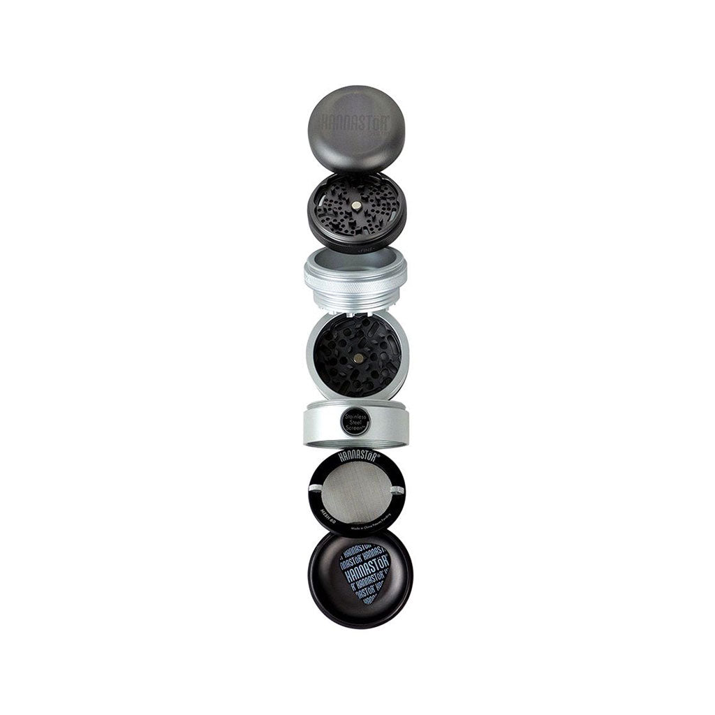 Top-down exploded view of the RYOT GR8TR Solid Body Grinder showing its stacked black and silver sections and mesh screen.