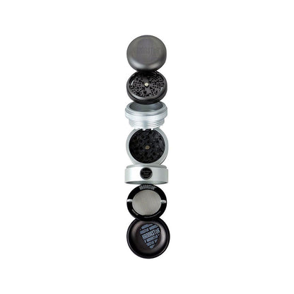 Top-down exploded view of the RYOT GR8TR Solid Body Grinder showing its stacked black and silver sections and mesh screen.
