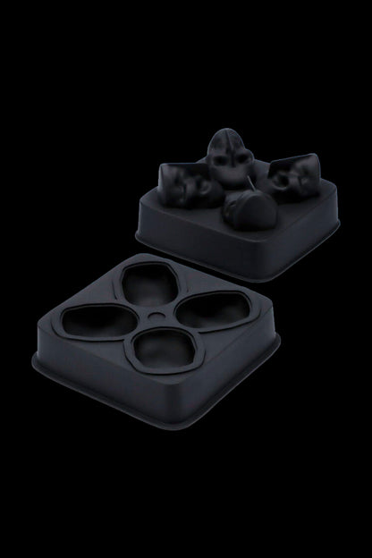 Black silicone cannabis concentrate container with separate compartments for different strains or extracts.