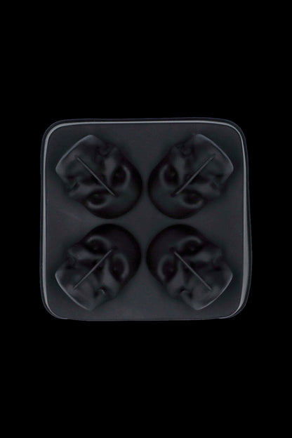 Black silicone ice cube tray with four cannabis leaf-shaped molds.