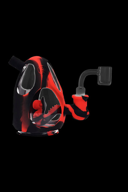 Red and black silicone rig with a quartz banger.