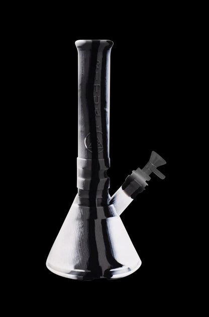 Black and white glass water pipe (bong) against a dark background.