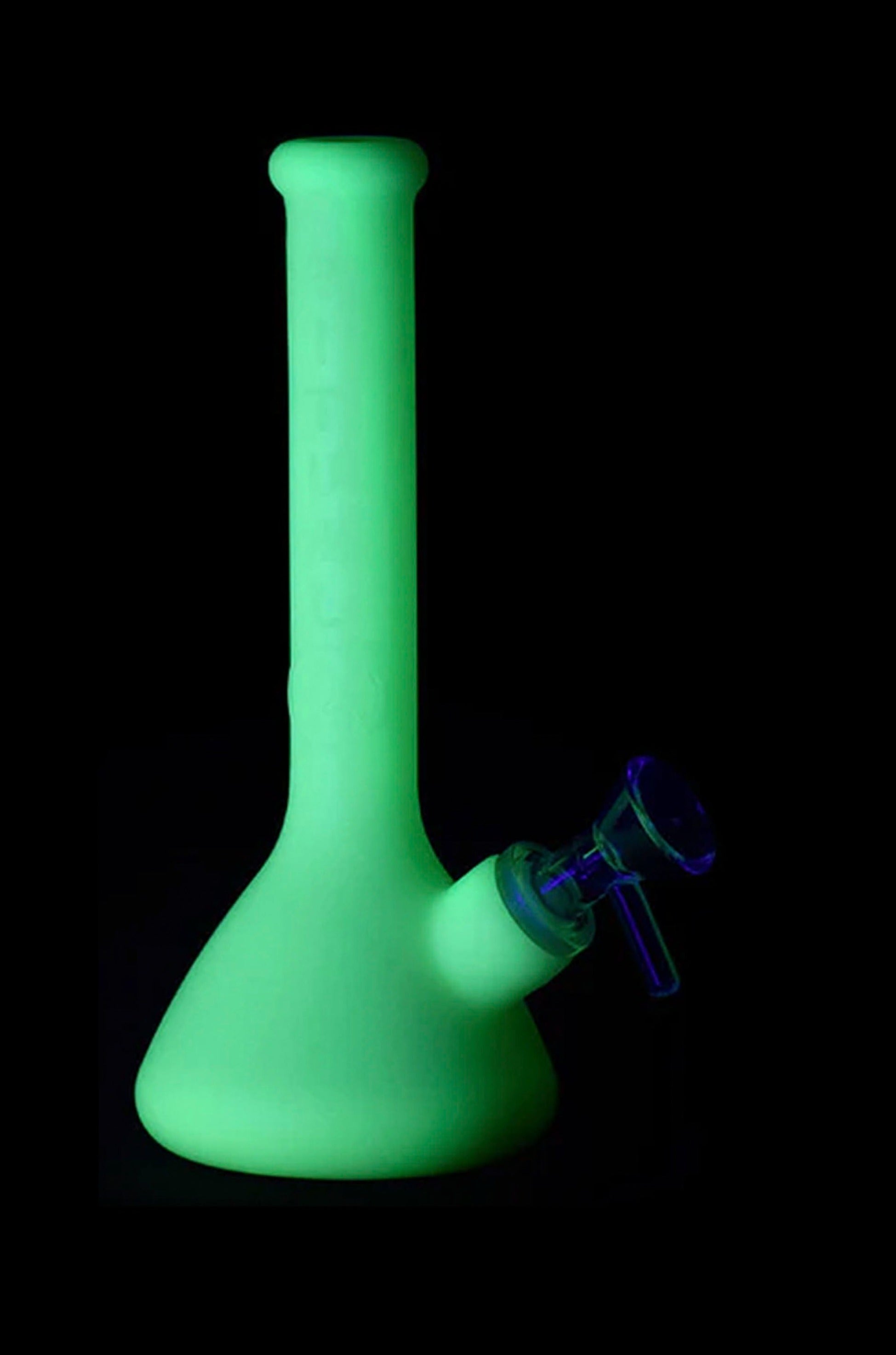Glowing green glass water pipe against a black background.