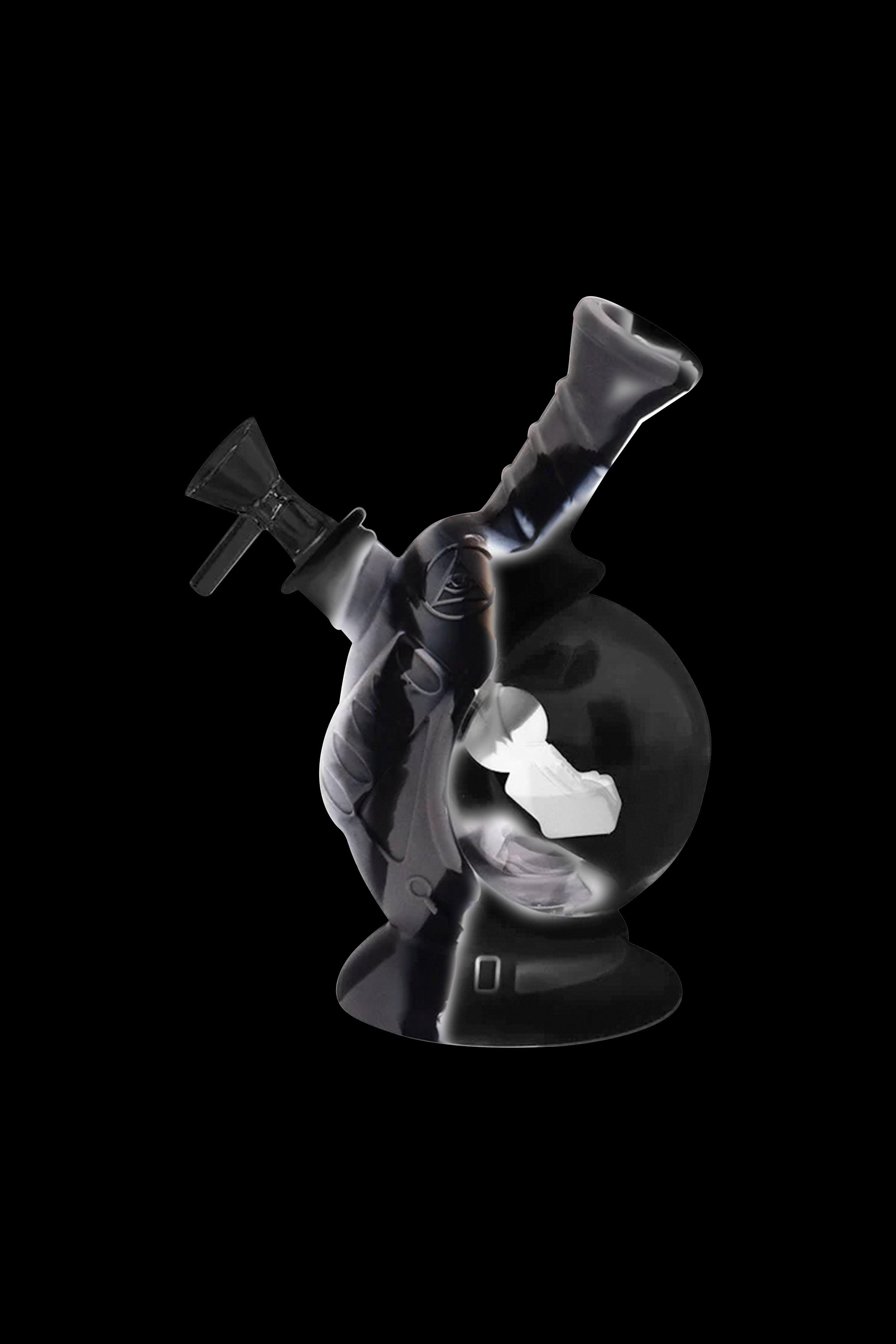 Glass water pipe (bong) with intricate sculpting, isolated on a black background.