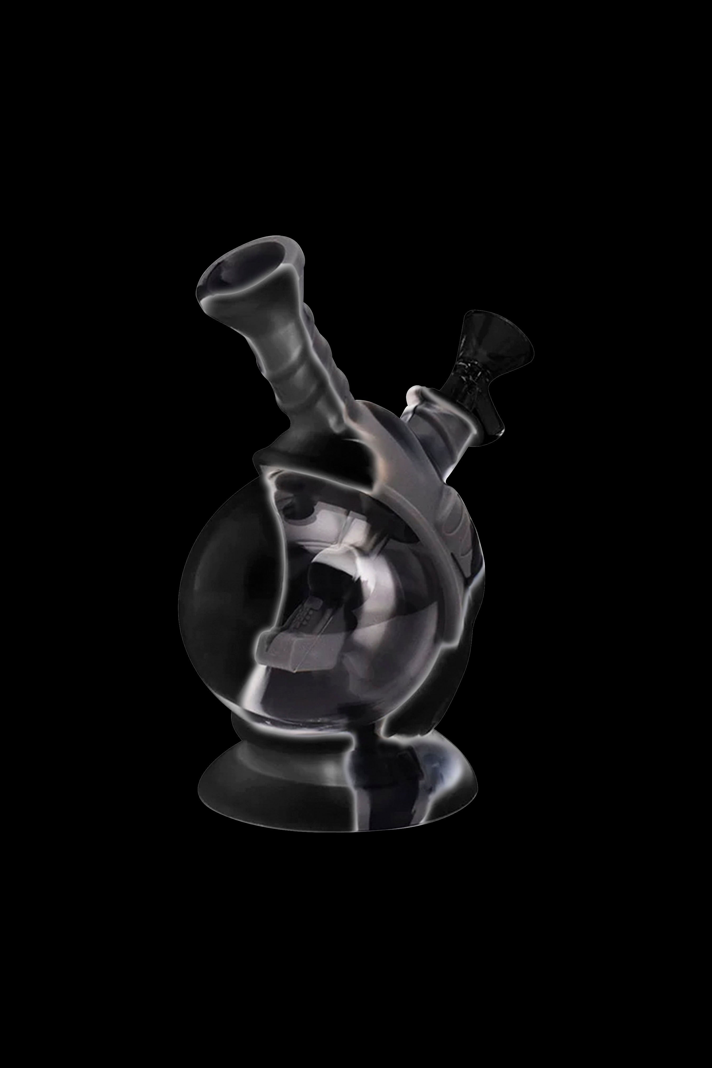 A translucent glass water pipe (bong) against a black background.