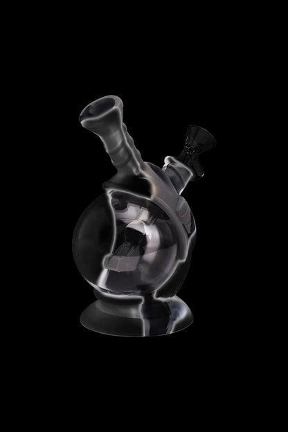 A translucent glass water pipe (bong) against a black background.