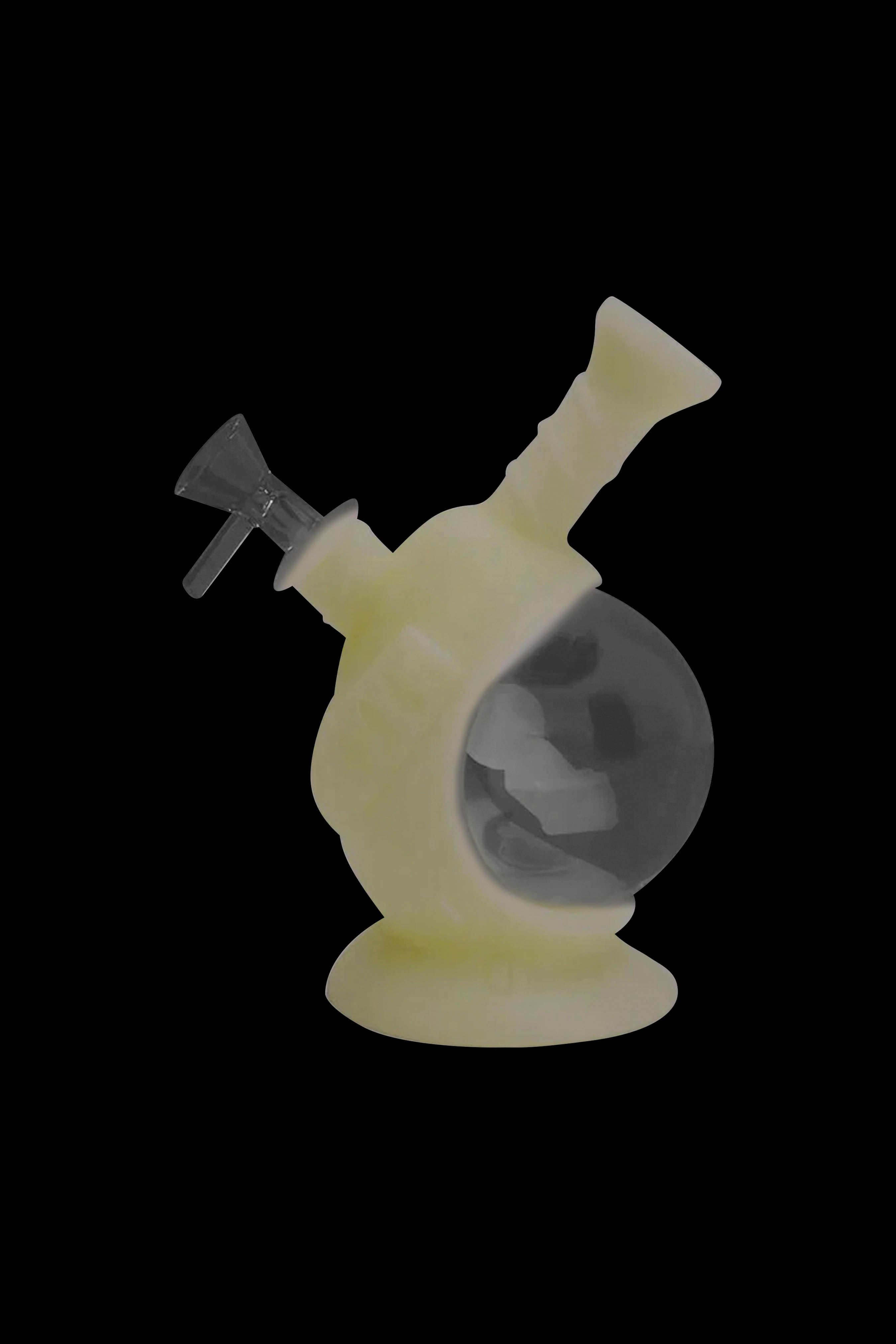 Yellow glass water pipe with swirling white accents, isolated on a black background.