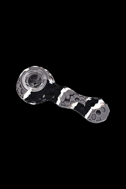 Black and white silicone cannabis pipe with skull pattern.