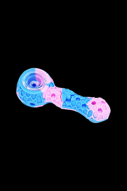 Pink and blue glass smoking pipe with textured grip.
