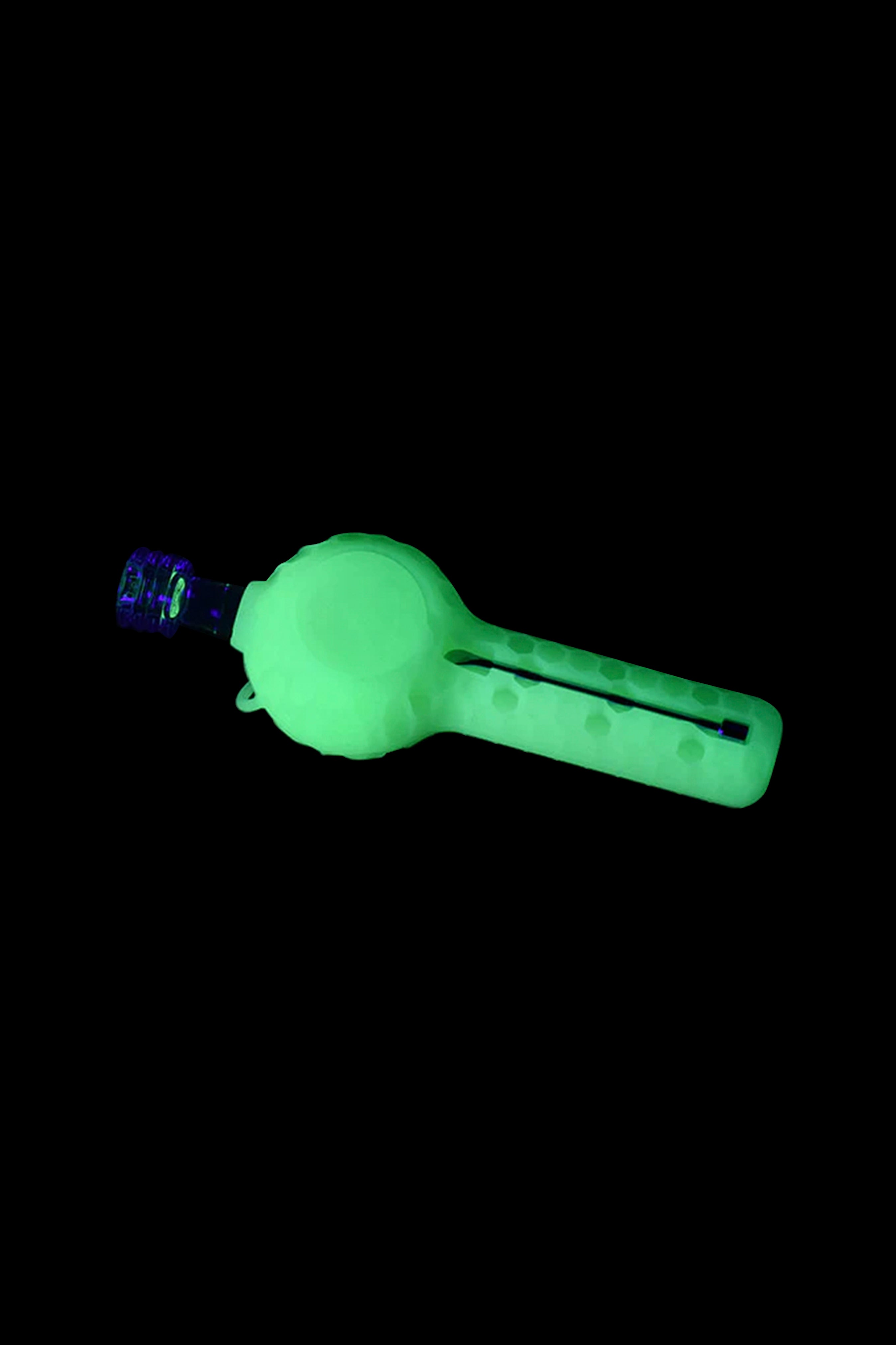 Glowing green silicone dab rig with glass bowl.