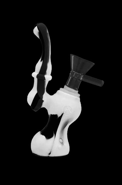 White glass dab rig with black accents, studio shot.