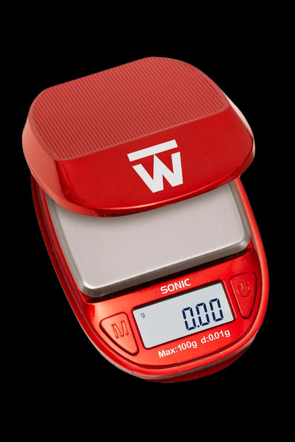 Red digital scale with a stainless steel weighing platform, displaying 0.00g.