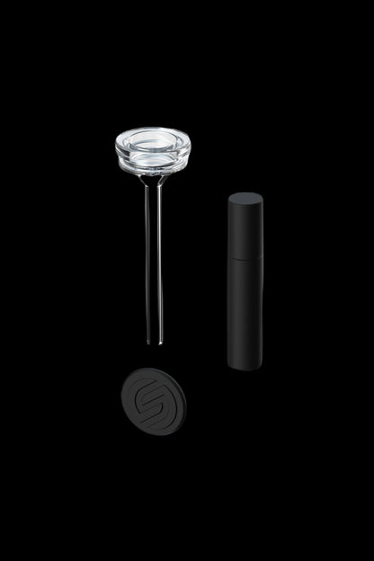 Disassembled cannabis oil burner with glass tip, metal rods, and black base.