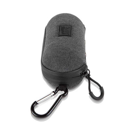 Angled close-up of a dark gray RYOT Hardcase with textured fabric, visible zipper, carabiner clip, and looped cord on a white background.