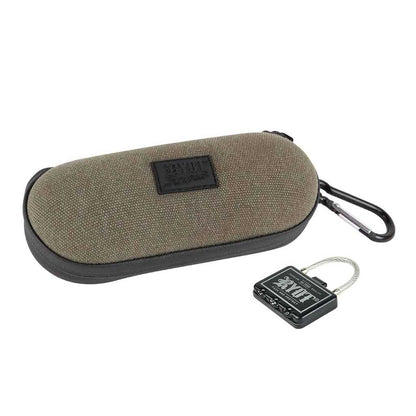 Angled studio shot of a khaki-textured RYOT Hardcase with a black zipper and carabiner, shown next to a small black cable padlock.