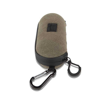 Top-down view of a khaki fabric and black-trim RYOT Hardcase with zipper pulls and attached black carabiner.