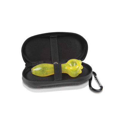 Open three-quarter view of a tan RYOT Hardcase unzipped to reveal a yellow glass hand pipe held by an interior elastic strap.