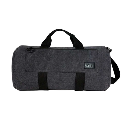 Front-facing shot of a black RYOT Pro-Duffle Carbon Series Smell-Proof Bag showing its short carry handles, detachable shoulder strap, and stitched front pocket with a small RYOT patch.