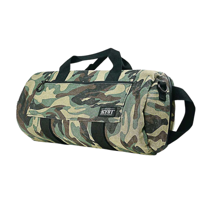 Angled front view of a camo RYOT Pro-Duffle Carbon Series Smell-Proof Bag showing black handles, front flap pocket, and side carry strap.