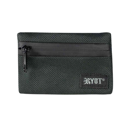 Close-up front view of the black RYOT Safe Case showing a textured fabric exterior, top zipper pull, and small stitched logo patch.