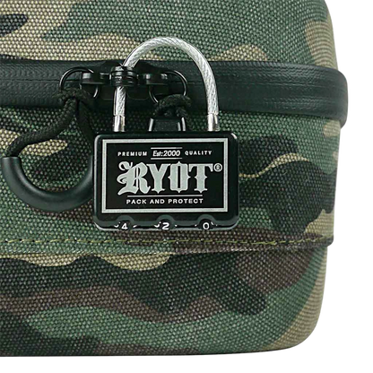 Close-up of a metal combination lock attached to a camouflage fabric RYOT Safe Case, shot straight-on to show the logo and zipper loop.