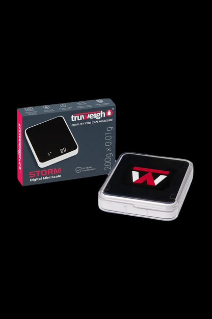 Black and red Truweigh Storm digital scale for measuring cannabis, displayed in its box.