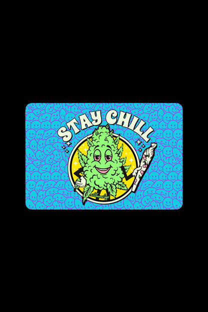 A turquoise patterned mat featuring a cartoon cannabis bud character with a smiling face, holding a joint, and the text "STAY CHILL."