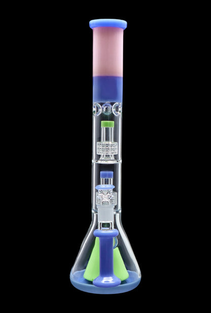 Blue and green glass bong with intricate percolators, isolated on a black background.