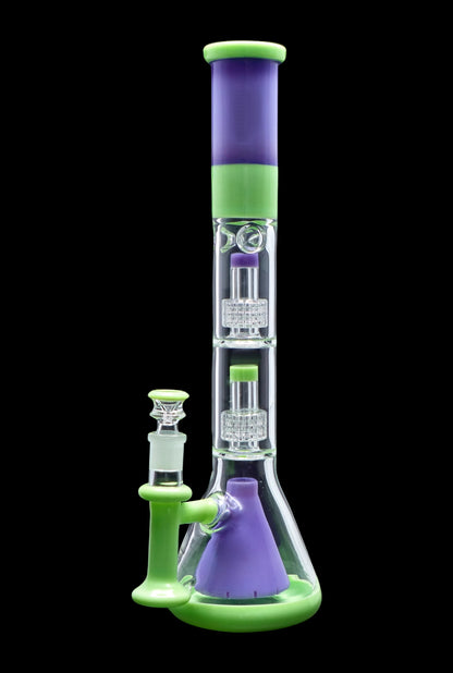 A vibrant green and purple glass bong with intricate percolators.