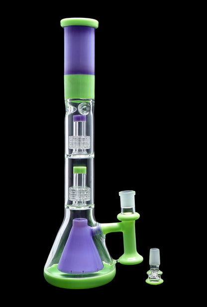 A vibrant green and purple glass bong with percolators, alongside a glass downstem and bowl piece.