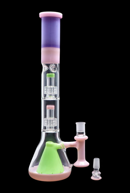 Pink and green glass bong with percolators, accompanied by a slide and bowl.