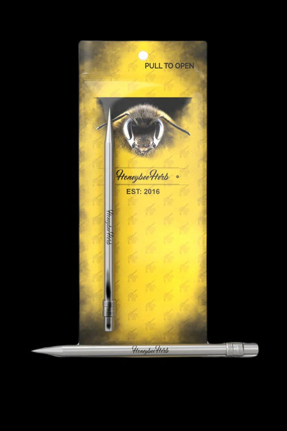 Packaged cannabis dab tool with bee imagery and “Honeybee Herbs” branding.